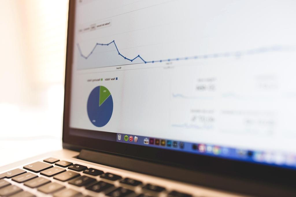 Network engineer analyzing wireless network performance graphs